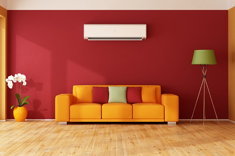 red and orange living room with ac, ductless ac system
